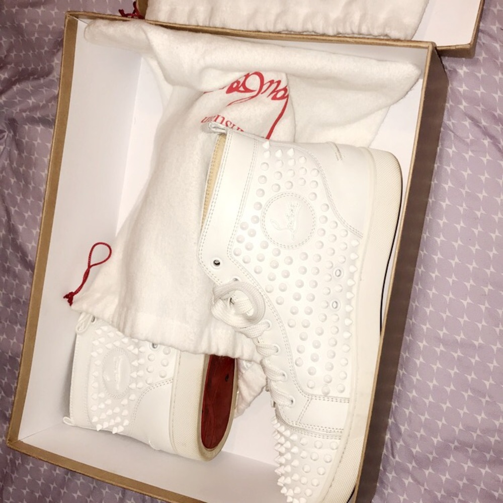 Christian louboutin White spiked Red Bottoms.